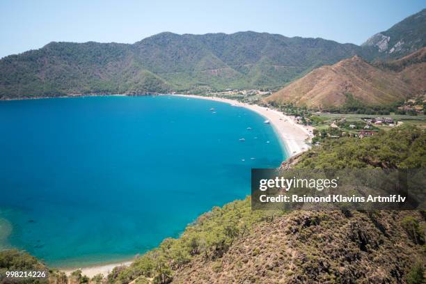 vivid blue sea laguna background turkey - laguna stockfoto's en -beelden