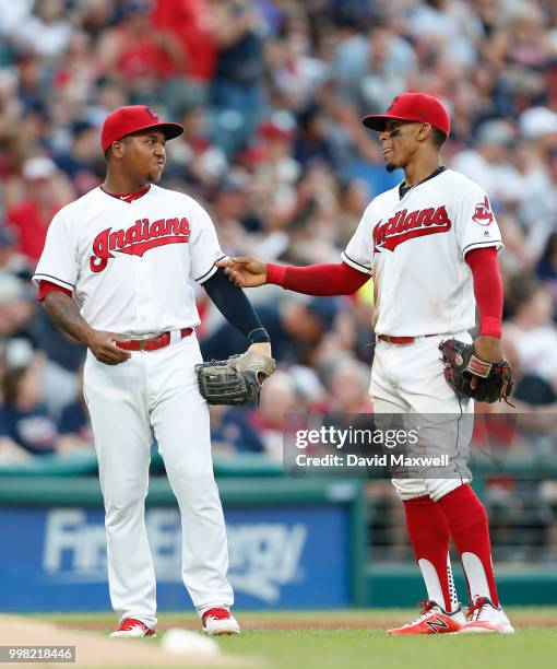 Jose Ramirez and Francisco Lindor of the Cleveland Indians talk as they take the field against the New York Yankees during the fourth inning at...