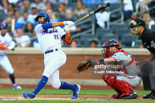 Jose Bautista of the New York Mets hits a RBI single in the first inning against the Washington Nationals at Citi Field on July 13, 2018 in the...