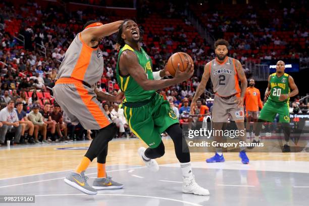 Josh Childress of the Ball Hogs dribbles the ball past DerMarr Johnson of 3's Company during BIG3 - Week Four at Little Caesars Arena on July 13,...