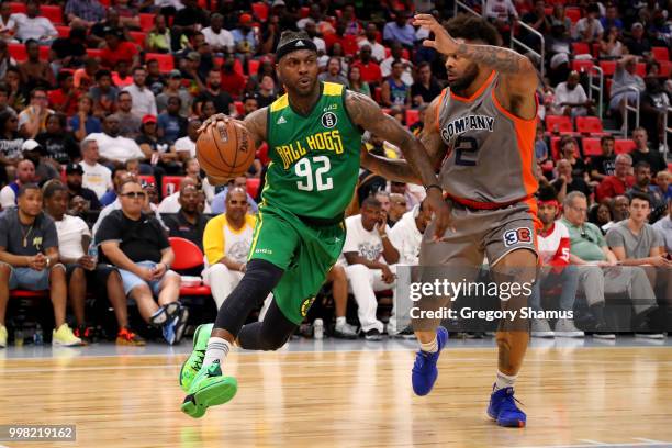 DeShawn Stevenson of the Ball Hogs dribbles the ball while being guarded by Andre Emmett of 3's Company during BIG3 - Week Four at Little Caesars...