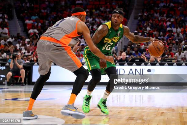 DeShawn Stevenson of the Ball Hogs dribbles the ball while being guarded by DerMarr Johnson of 3's Company during BIG3 - Week Four at Little Caesars...