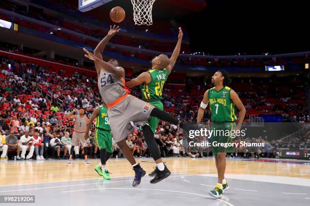 Jason Maxiell of 3's Company attempts a shot while being guarded by Andre Owens of the Ball Hogs during BIG3 - Week Four at Little Caesars Arena on...