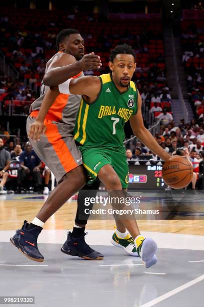 Josh Childress of the Ball Hogs dribbles the ball while being guarded by Jason Maxiell of 3's Company during BIG3 - Week Four at Little Caesars Arena...