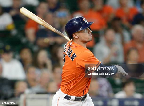 Alex Bregman of the Houston Astros hits a two-run home run in the first inning against the Detroit Tigers at Minute Maid Park on July 13, 2018 in...