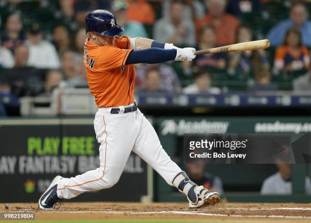 Alex Bregman of the Houston Astros hits a two-run home run in the first inning against the Detroit Tigers at Minute Maid Park on July 13, 2018 in...
