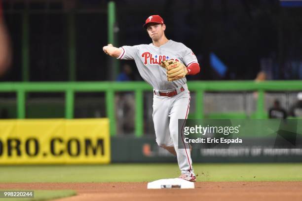 Scott Kingery of the Philadelphia Phillies throws towards first base during the fourth inning against the Miami Marlins at Marlins Park on July 13,...