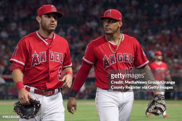 The Los Angeles Angels' Ian Kinsler and Jefry Marte head to the dugout against the Seattle Mariners in Anaheim on Wednesday, July 11, 2018.