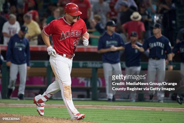 The Los Angeles Angels Mike Trout jogs to the dugout after lining out to center fir the last out of the game against the Seattle Mariners in Anaheim...