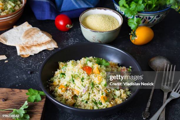 tabbouleh healthy cous cous salad or side dish in bowl - side salad stock pictures, royalty-free photos & images