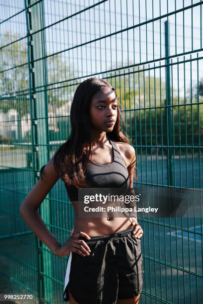 young woman taking break in sports court - langley city stock pictures, royalty-free photos & images