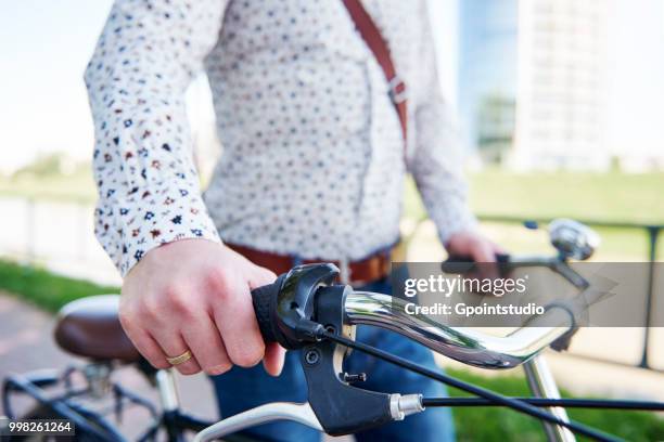 man with bicycle, cropped - gpointstudio imagens e fotografias de stock