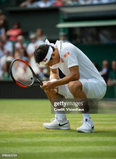 Kei Nishikori of Japan during his quarter-final match against Novak Djokovic of Serbia on day nine of the Wimbledon Lawn Tennis Championships at the...