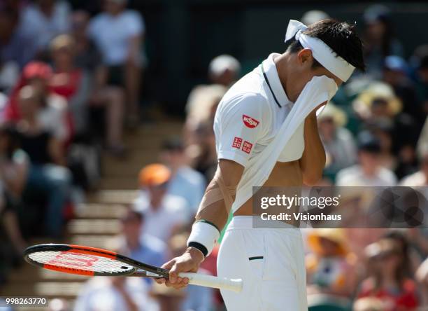 Kei Nishikori of Japan during his quarter-final match against Novak Djokovic of Serbia on day nine of the Wimbledon Lawn Tennis Championships at the...