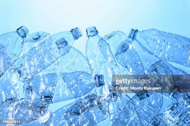 still life of plastic bottles, source of pollution - plastikmaterial stock-fotos und bilder