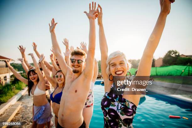 group of friends enjoy summer on swimming pool and beach - drazen stock pictures, royalty-free photos & images