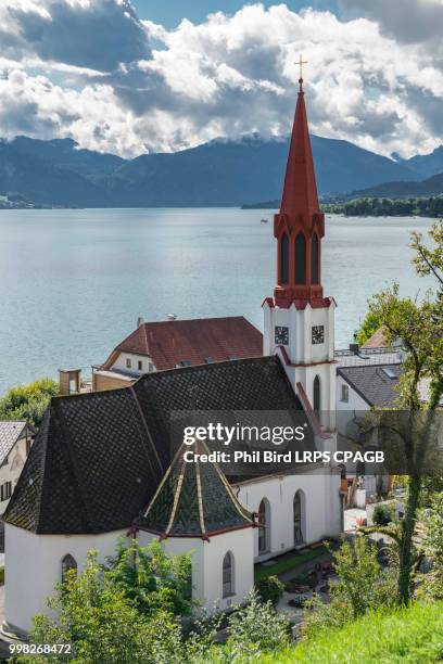 view of the evangelical parish church in attersee - attersee stock pictures, royalty-free photos & images