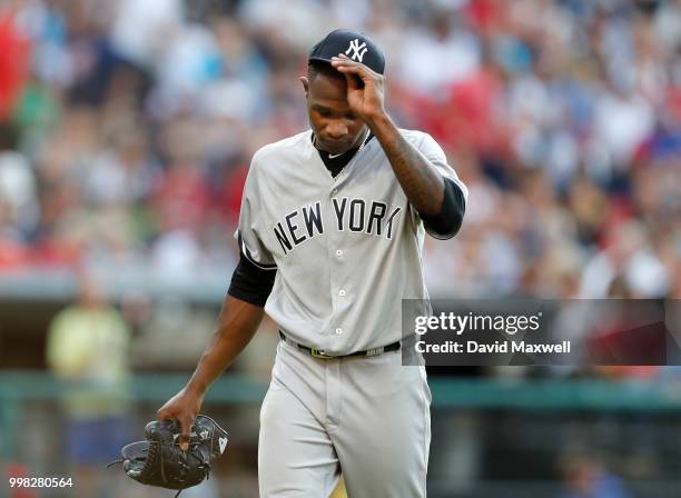 Domingo German of the New York Yankees walks to the dugout against the Cleveland Indians in the second inning at Progressive Field on July 13, 2018...