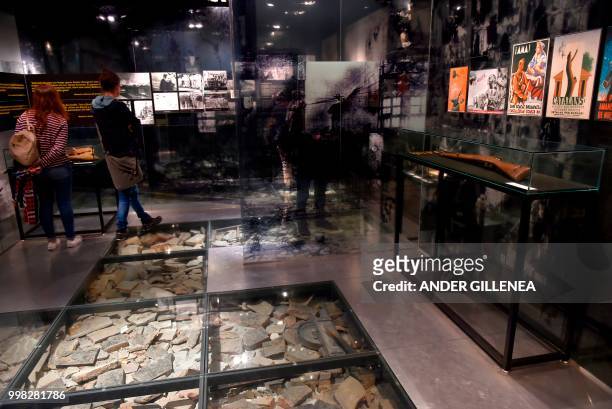 People visit the Peace Museum in the Spanish Basque village of Guernica on May 4, 2018. - In Spain, the issue of remembrance is especially relevant...