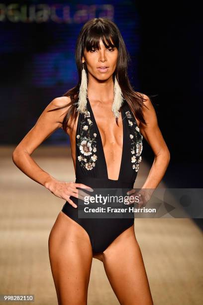 Model walks the runway for Aguaclara during the Paraiso Fashion Fair at The Paraiso Tent on July 13, 2018 in Miami Beach, Florida.