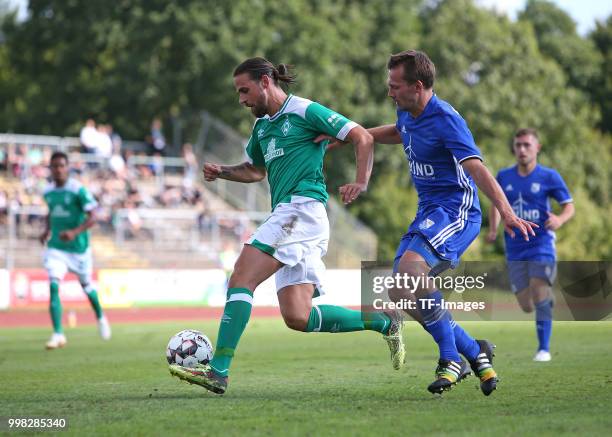 Martin Harnik of Werder Bremen and Nils Richter of Eintracht Cuxhaven battle for the ball during the friendly match between FC Eintracht Cuxhaven and...