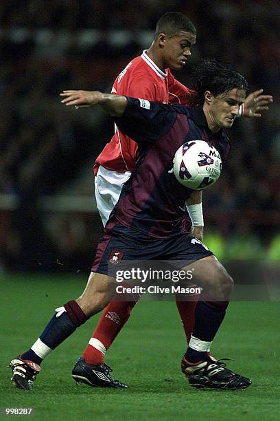 Benito Carbone of Bradfordholds of fJermaine Jenas of Forest during the Nationwide First Division match between Nottingham Forest and Bradford City...