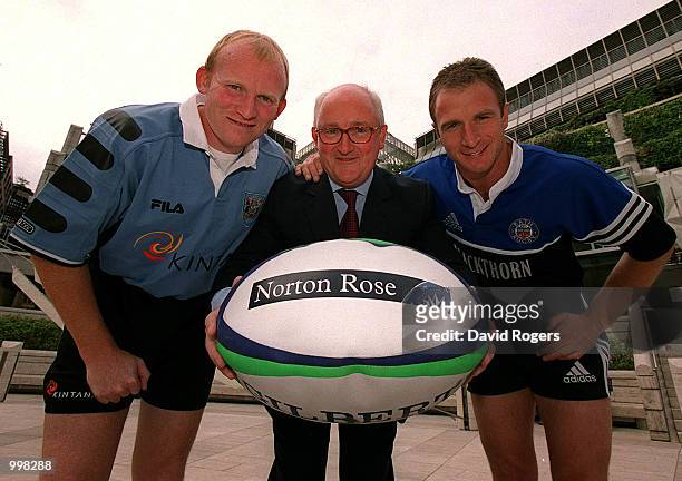 Neil Jenkins of Cardiff and Mike Catt of Bath pose with Roger Birkby, Managing Partner of International law firm Norton Rose, at a photocall in...