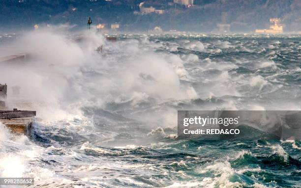 Trieste city and the Adriatic Sea during the wind phenomenon called Bora. Friuli-Venezia Giulia. Italy. Europe. Photo by: Carlo...