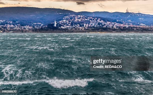 Trieste city and the Adriatic Sea during the wind phenomenon called Bora. Friuli-Venezia Giulia. Italy. Europe. Photo by: Carlo...