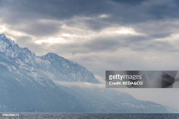 Panoramic winter view of Lake Como and the Alps. Lombardia. Italy. Europe. Photo by: Carlo Borlenghi/REDA&CO/Universal Images Group via Getty Images