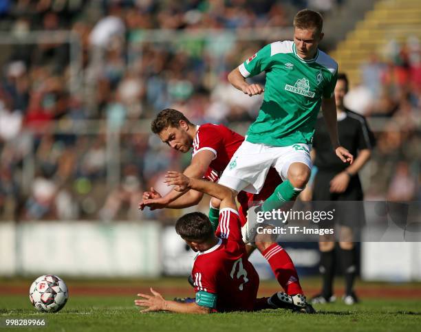 Igro Casanova of Bremerhaven, Peter Lazik of Bremerhaven and Aron Johannsson of Werder Bremen battle for the ball during the friendly match between...