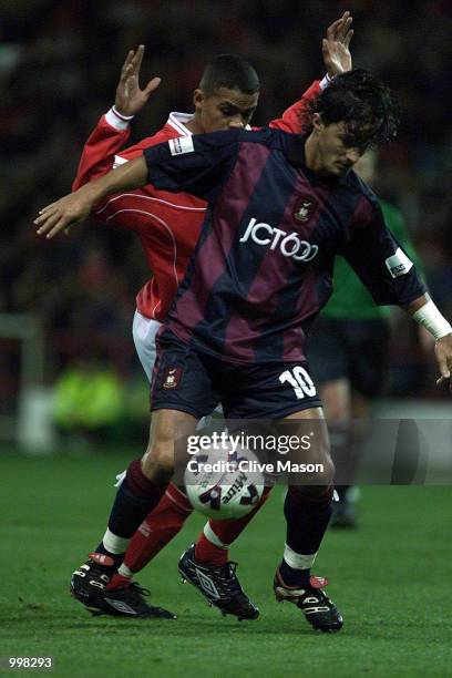 Benito Carbone of Bradford holds off Jermaine Jenas of Forest during the Nationwide first division match between Nottingham Forest and Bradford City...