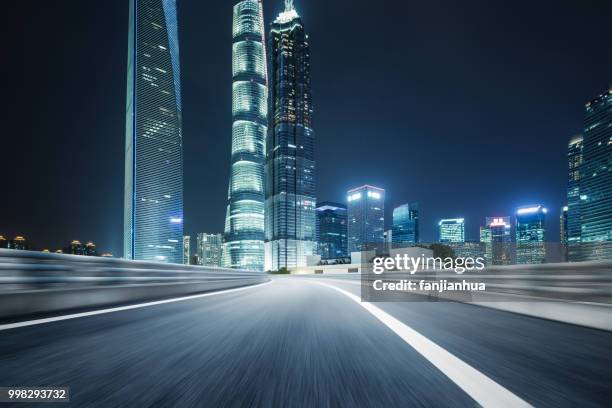 inner city elevated road by modern skyscrapers,shanghai - jin mao tower stock pictures, royalty-free photos & images