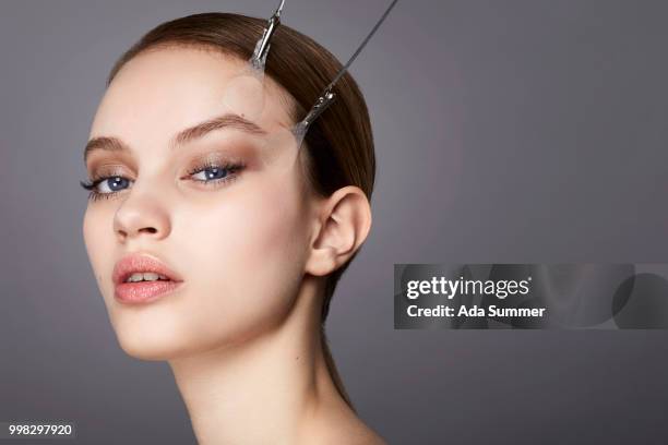 studio beauty shot of a woman - pull a face foto e immagini stock