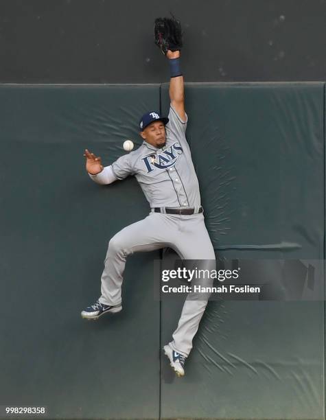 Carlos Gomez of the Tampa Bay Rays is unable to catch an RBI triple hit by Jorge Polanco of the Minnesota Twins during the first inning of the game...