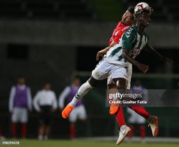 Vitoria Setubal forward Valdu Te from Guinea Bissau with SL Benfica defender Andre Almeida from Portugal in action during the Pre-Season Friendly...