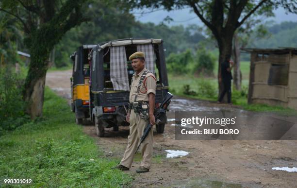 This photo taken on July 10, 2018 shows Indian security personnel near the site of the lynching of two men in Panjuri Kachari village, in Karbi...