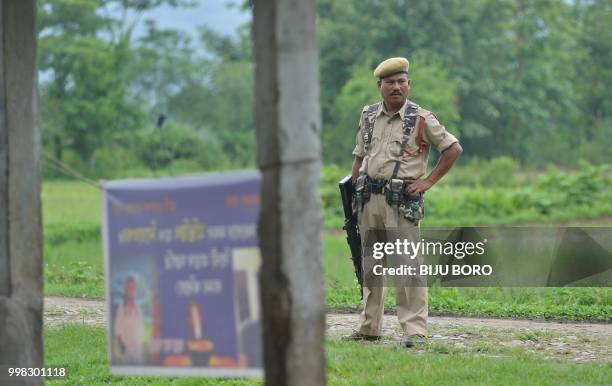 This photo taken on July 10, 2018 shows Indian security personnel near the site of the lynching of two men in Panjuri Kachari village, in Karbi...