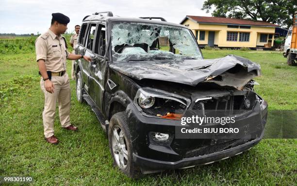 This photo taken on July 10, 2018 shows Gulshan Daolagupu, deputy superintendent of police, showing the damaged vehicle in which two men were lynched...