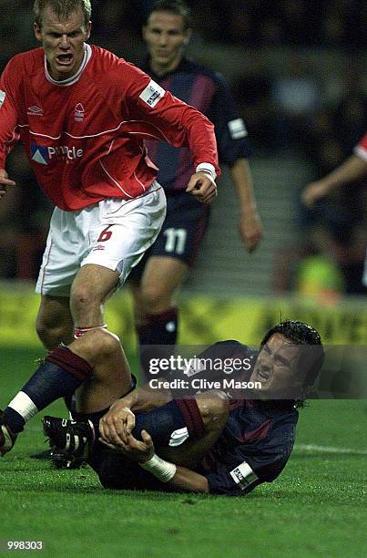 Benito Carbone of Bradford gets a free kick to the disdain of Jon Olav Hjelde of Forest during the Nationwide first division match between Nottingham...