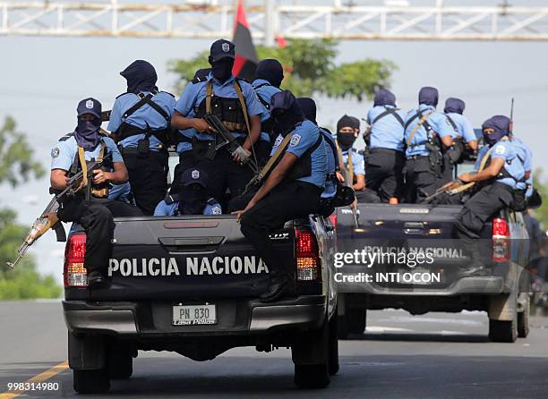 Police forces arrive in Masaya, some 35 km from Managua, where supporters of Nicaraguan President Daniel Ortega celebrate the 39th anniversary of the...