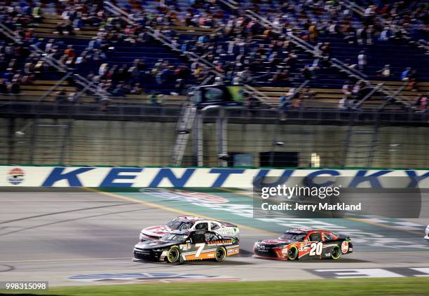 Justin Allgaier, driver of the Dale Jr's Whisky River Chevrolet, leads a pack of cars during the NASCAR Xfinity Series Alsco 300 at Kentucky Speedway...