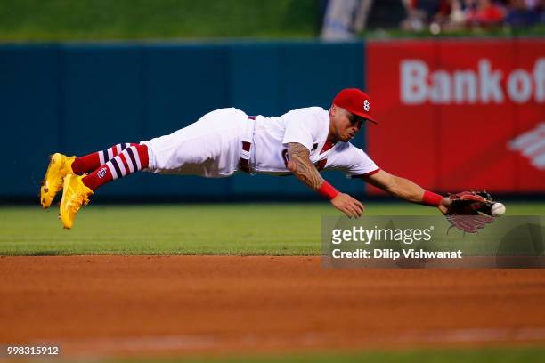 Kolten Wong of the St. Louis Cardinals attempts to catch a line drive against the Cincinnati Reds in the third inning at Busch Stadium on July 13,...