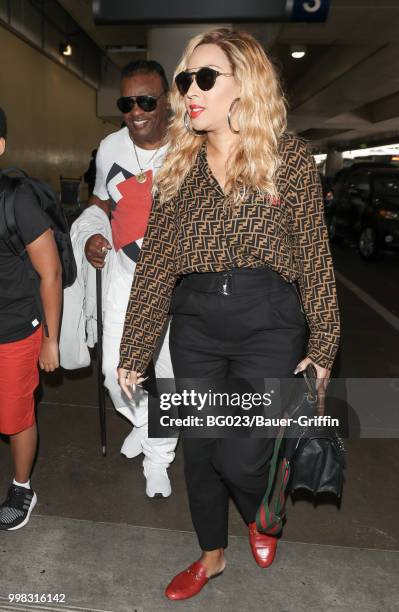 Ronald Isley and his wife, Kandy are seen on July 13, 2018 in Los Angeles, California.