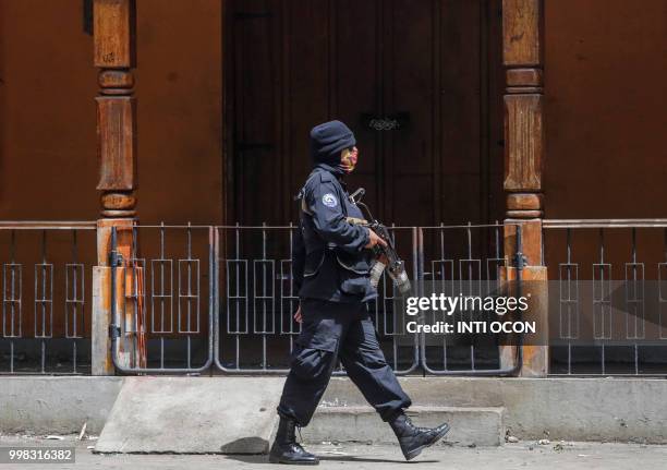 Member of the police force takes part in the confrontions with anti-government demonstrators at Monimbo neighbourhood in Masaya, some 35 km from...