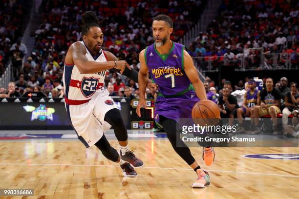 Mahmoud Abdul-Rauf of the 3 Headed Monsters dribbles the ball while being guarded by Robert Hite of Tri-State during BIG3 - Week Four at Little...