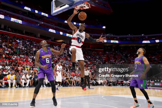 Amar'e Stoudemire of Tri-State dunks the ball past Qyntel Woods and Mahmoud Abdul-Rauf of the 3 Headed Monsters during BIG3 - Week Four at Little...