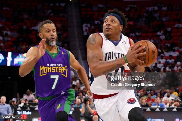 David Hawkins of Tri-State dribbles the ball while being guarded by Mahmoud Abdul-Rauf of the 3 Headed Monsters during BIG3 - Week Four at Little...