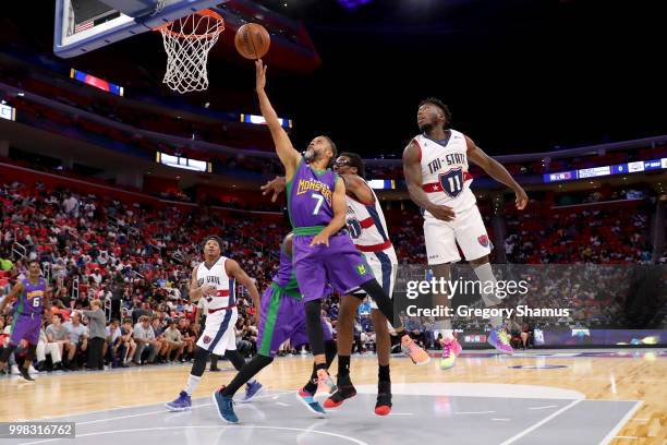 Mahmoud Abdul-Rauf of the 3 Headed Monsters attempts a shot while being guarded by Nate Robinson of Tri-State during BIG3 - Week Four at Little...