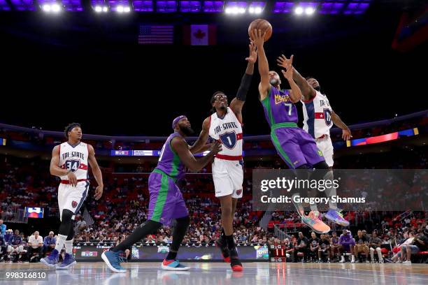 Mahmoud Abdul-Rauf of the 3 Headed Monsters attempts a shot while being guarded by Nate Robinson of Tri-State during BIG3 - Week Four at Little...